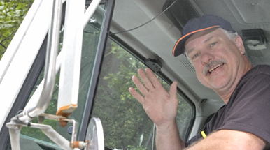 William Sarver of Awe Oil, Inc. in one of his fleet oil delivery trucks.